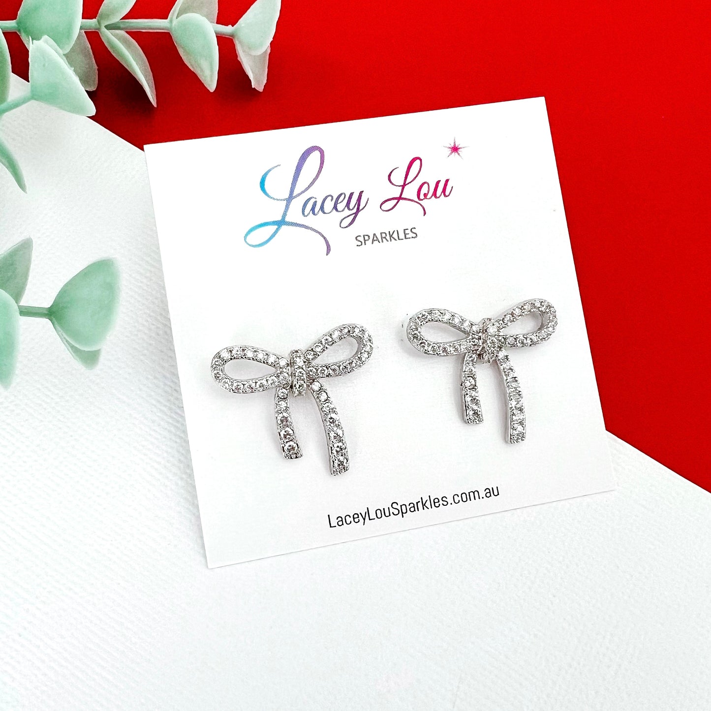 Lucy Silver Rhinestone Bow Stud Earrings